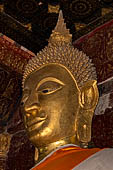 Wat Xieng Thong temple in Luang Prabang, Laos.  Detail of the main Buddha statue inside the 'sim'. 